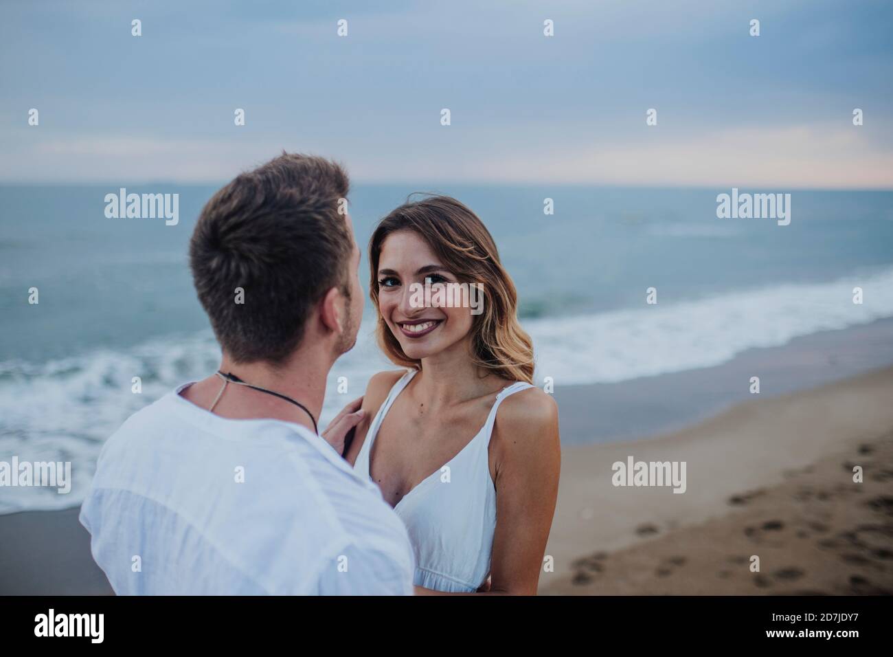 Woman and man on beach hi-res stock photography and images - Alamy