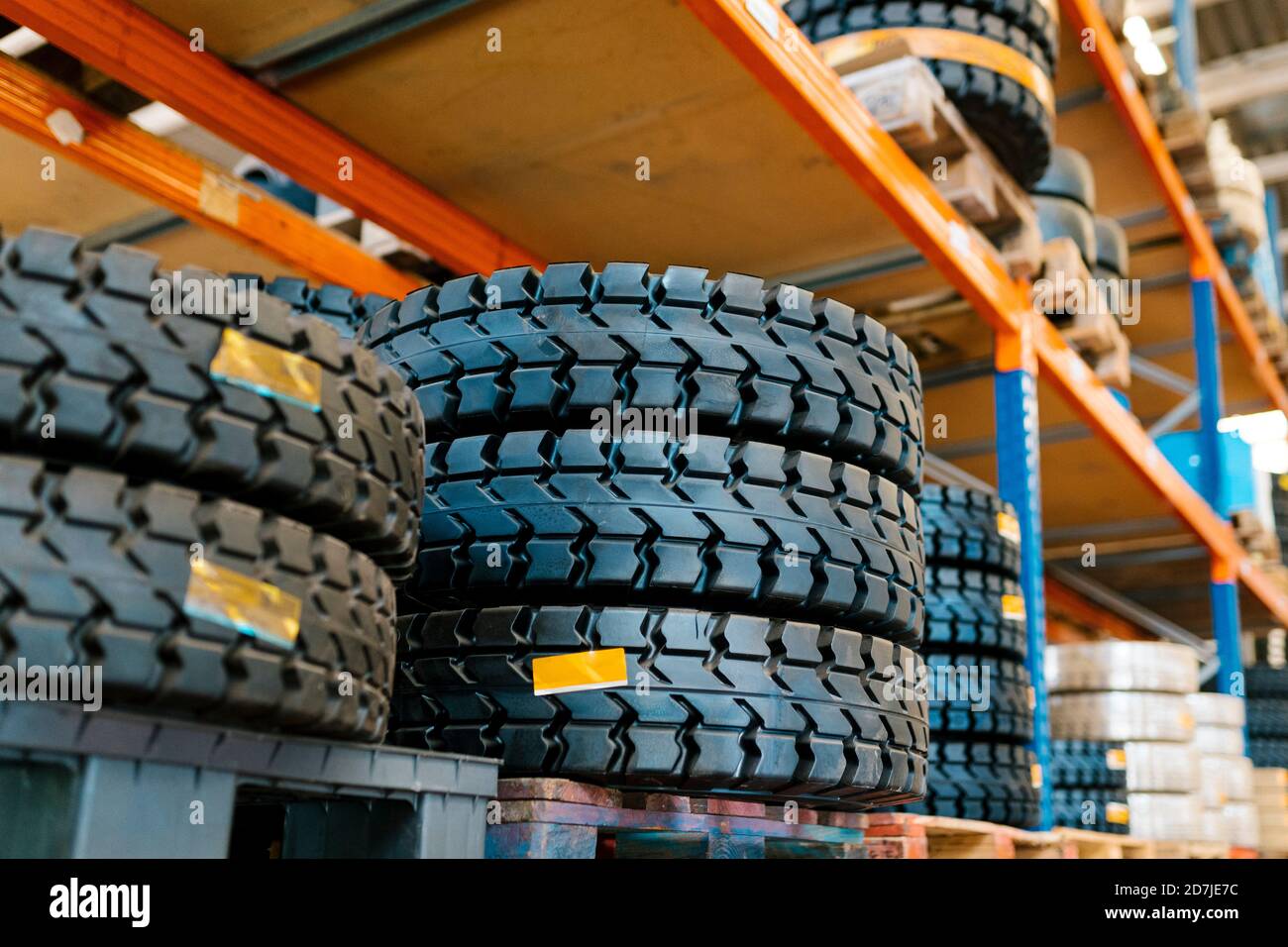 Tires on rack in auto repair shop Stock Photo Alamy