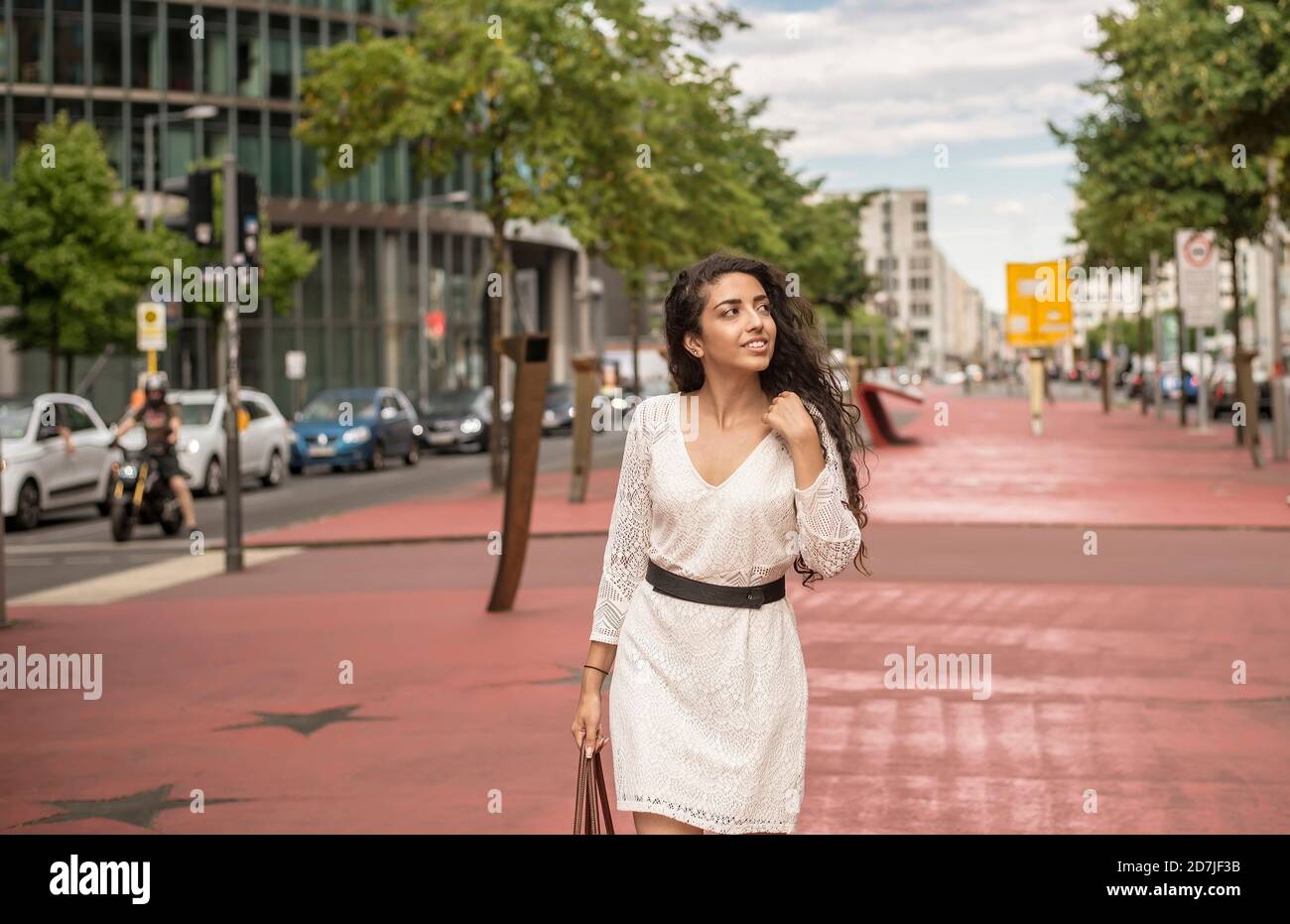 Woman in white dress walking hi-res stock photography and images - Alamy