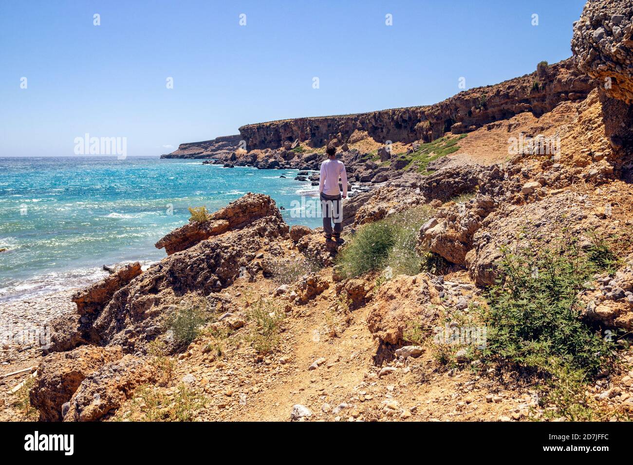 Man admiring view while standing on beach at Plakias, Crete, Greece Stock Photo