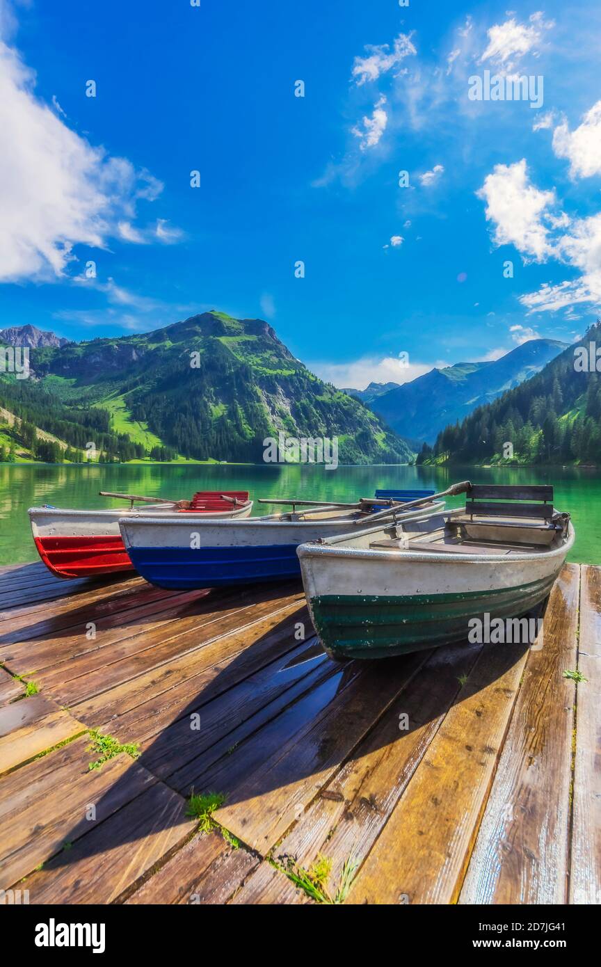 Motorboats left on lakeshore jetty in Tannheimer Tal Stock Photo
