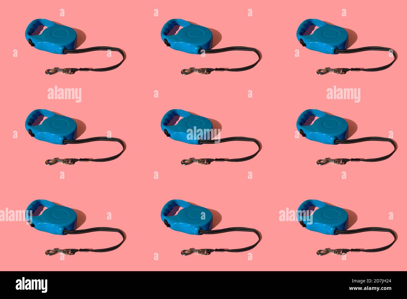 Retractable pet leashes on colored background Stock Photo