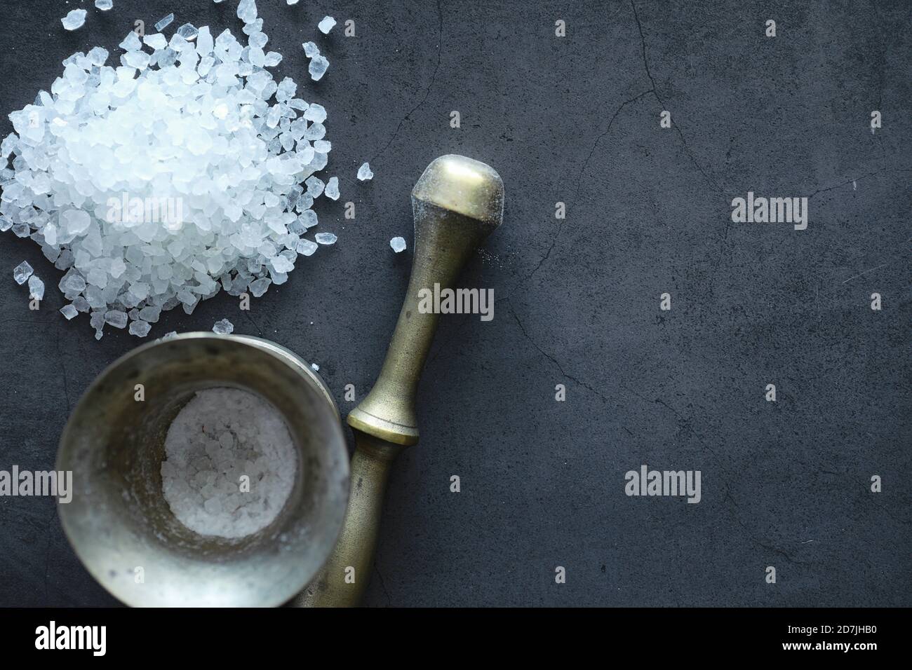 Large sea salt. Spice. Mortar and pestle for grinding Stock Photo Alamy
