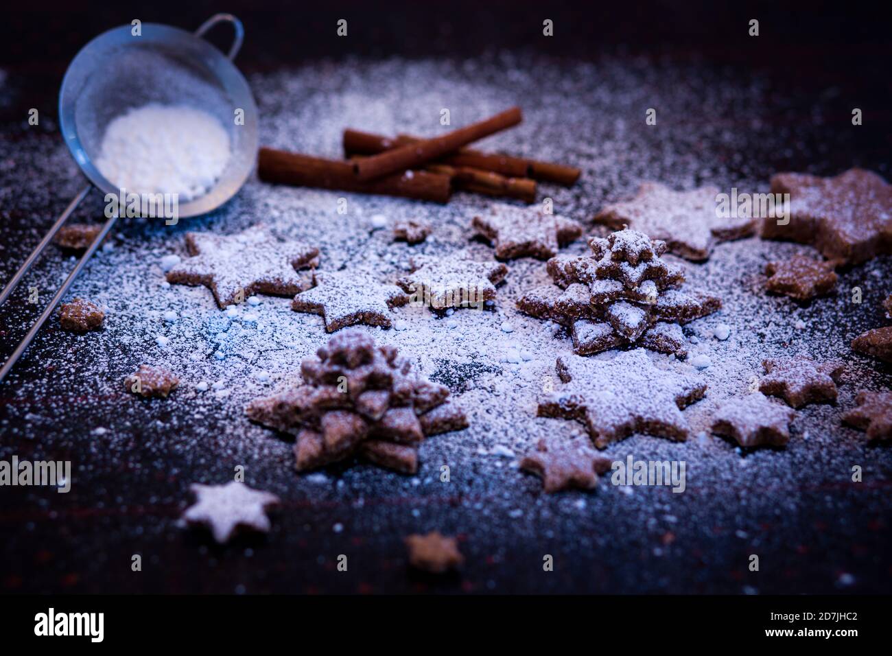 Star shaped cookie with sprinkled flour kept on table Stock Photo
