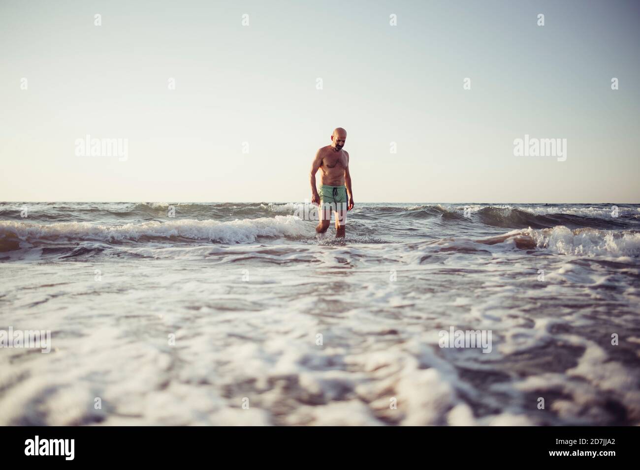 Senior man walking beach during hi-res stock photography and images - Alamy