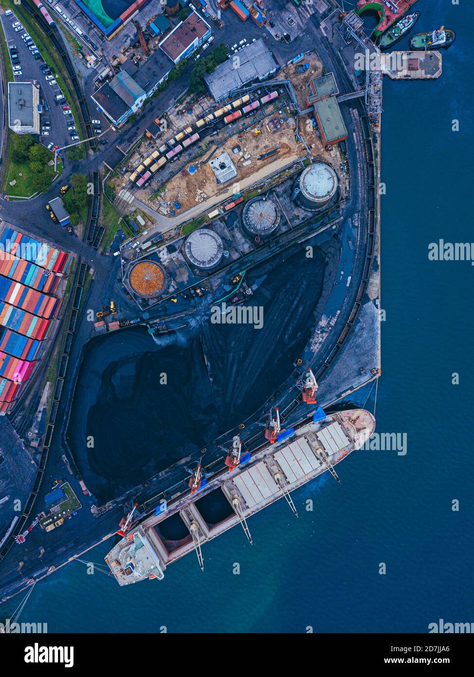 Russia, Primorsky Krai, Vladivostok, Aerial view of industrial ship moored in coal loading dock Stock Photo