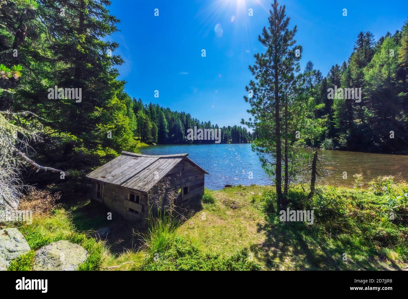 Old wood house by lake at Turracher Hoehe, Gurktal Alps, Austria Stock Photo