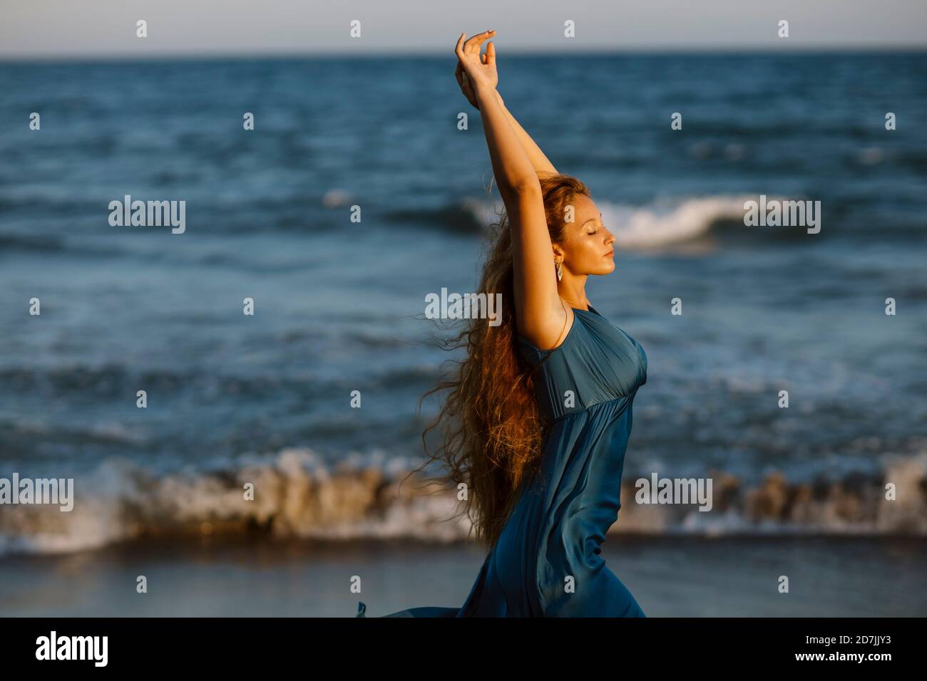 Woman standing edge sea hi-res stock photography and images - Alamy