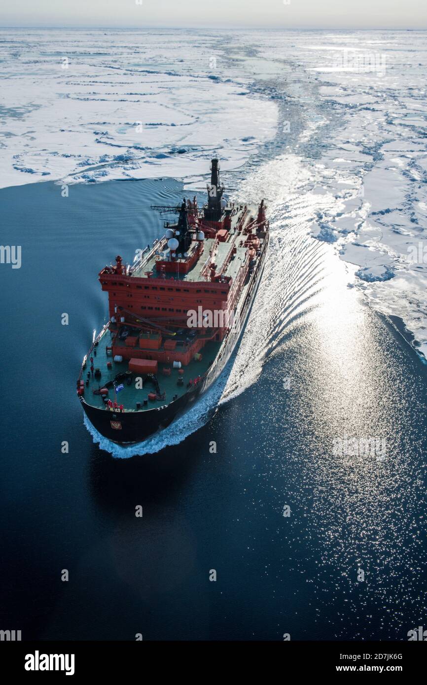 Aerial view of ice-breaker 50 Years of Victory cleaving through ice of Arctic Ocean Stock Photo