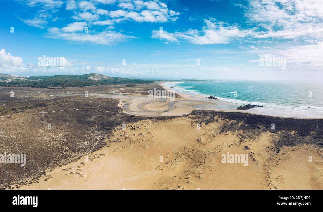 Scenic view of Dunas de Corrubedo against sky on sunny day, Galicia, Spain Stock Photo