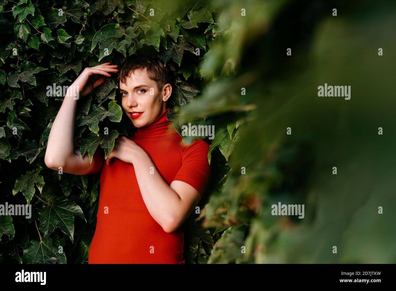 young nude binaries Nude non-binary person with red dress on tree trunk in forest Stock Photo -  Alamy