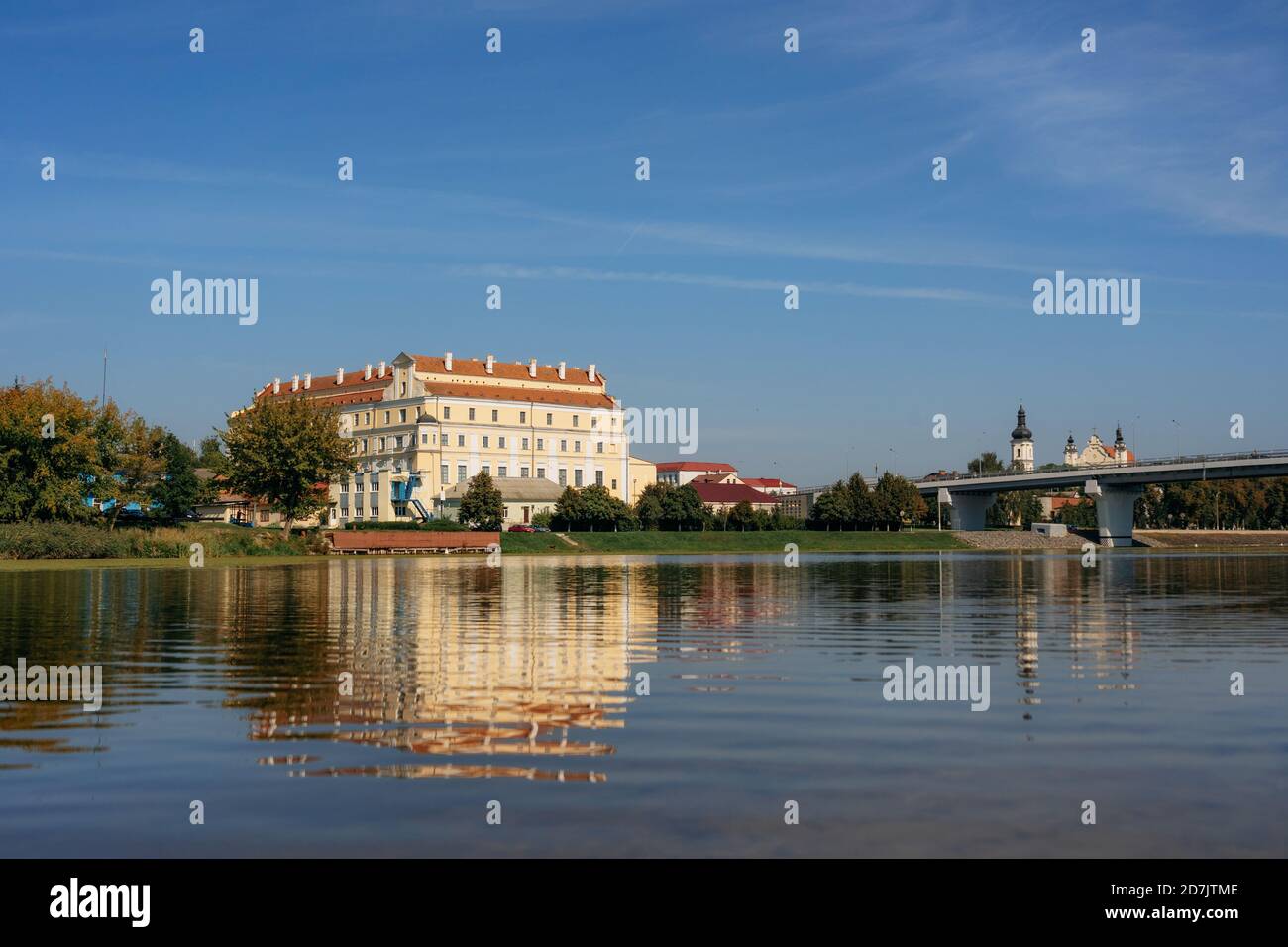 Jesuit collegium building and bridge in Pinsk with reflecrtion in Pina river, Belarus Stock Photo