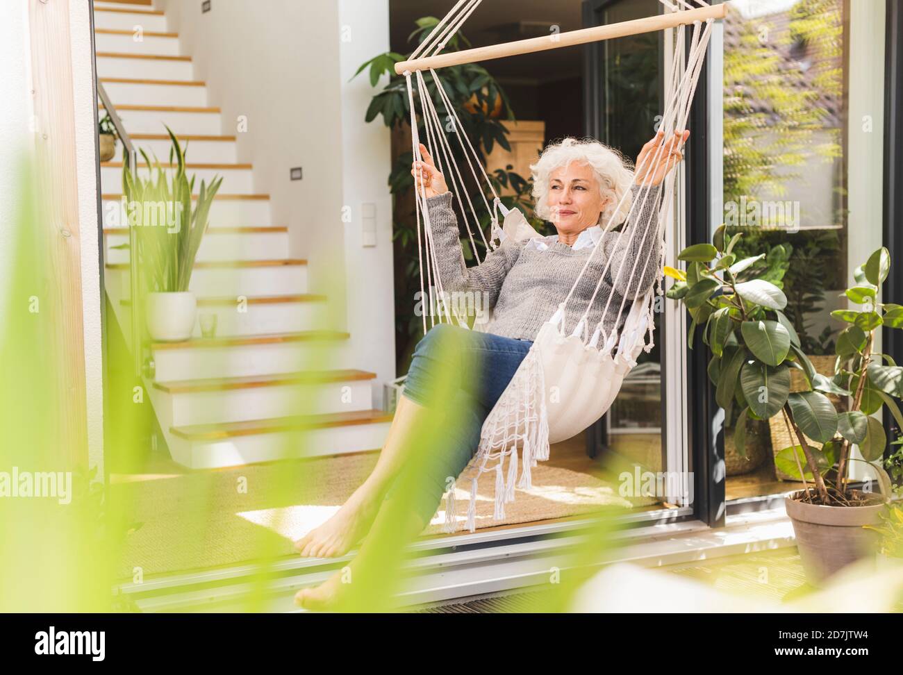 Mature woman on swing hi-res stock photography and images - Alamy
