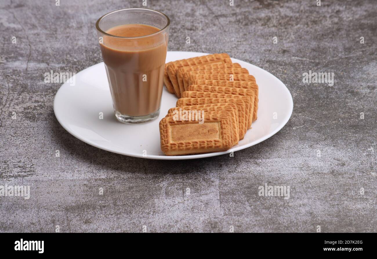 Cutting Chai, Traditional Desi Roadside tea of india with biscuits. Stock Photo