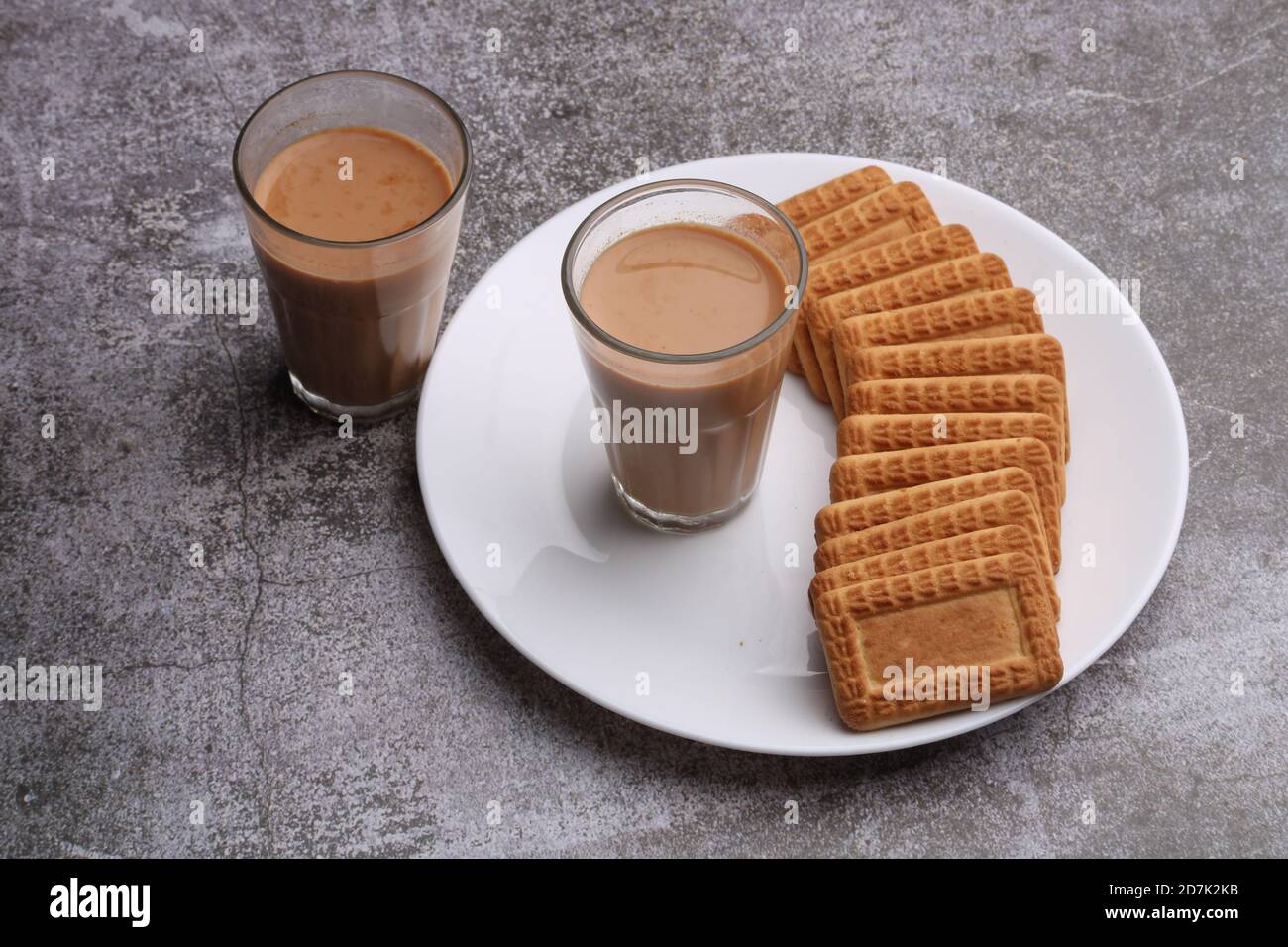 Cutting Chai, Traditional Desi Roadside tea of india with biscuits. Stock Photo