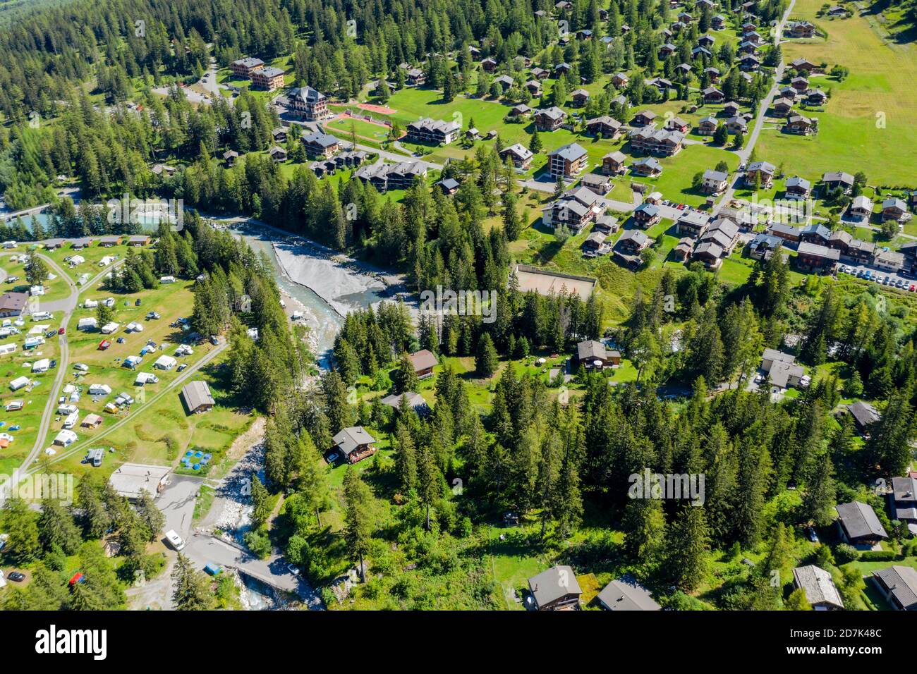 Drone shot,  Camp site and village of La Fouly at a glacial river, holiday cottages, Switzerland Stock Photo