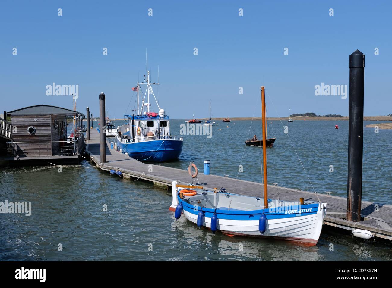 Wells Harbour Norfolk UK showing 2 moored boats one being a traditional