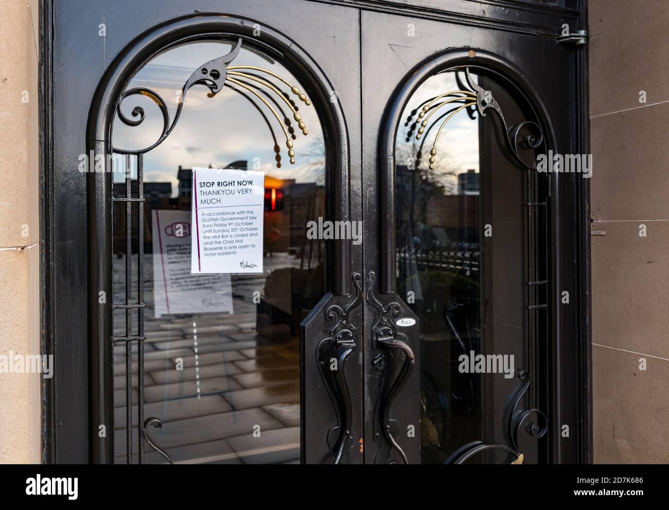 The Shore, Leith, Edinburgh, Scotland, United Kingdom, 23rd October 2020. Bars & restaurants: many restaurants are closed as the Scottish Government extends restrictions during the Covid-19 pandemic for a 3rd week, but many are still open serving takeaway food and beer. A notice in the window tells customers that the Malmaison Hotel's Chez Mal restaurant is only open to hotel guests Stock Photo