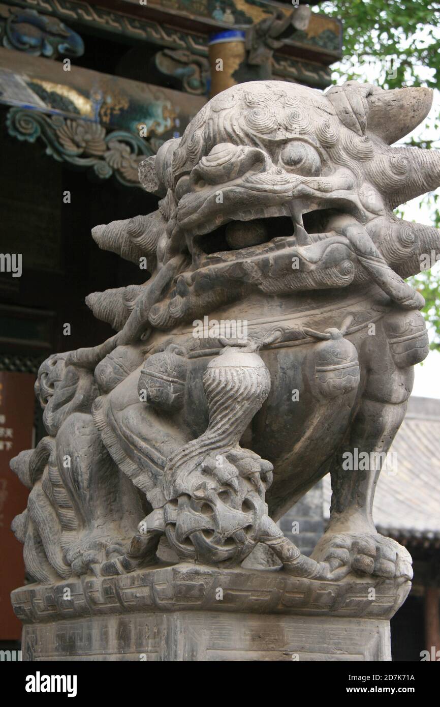 statue-of-a-chinese-guardian-lion-in-a-taoist-temple-qing-xu-guan-in