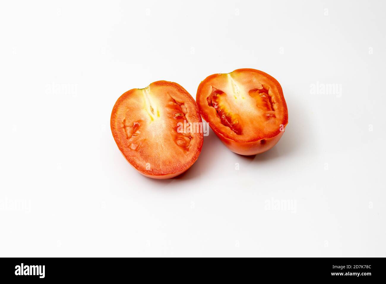 Sliced delicious tomato on white background Stock Photo