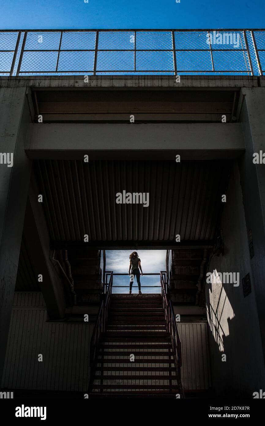 Fit Woman Doing workout at a Stadium Stock Photo