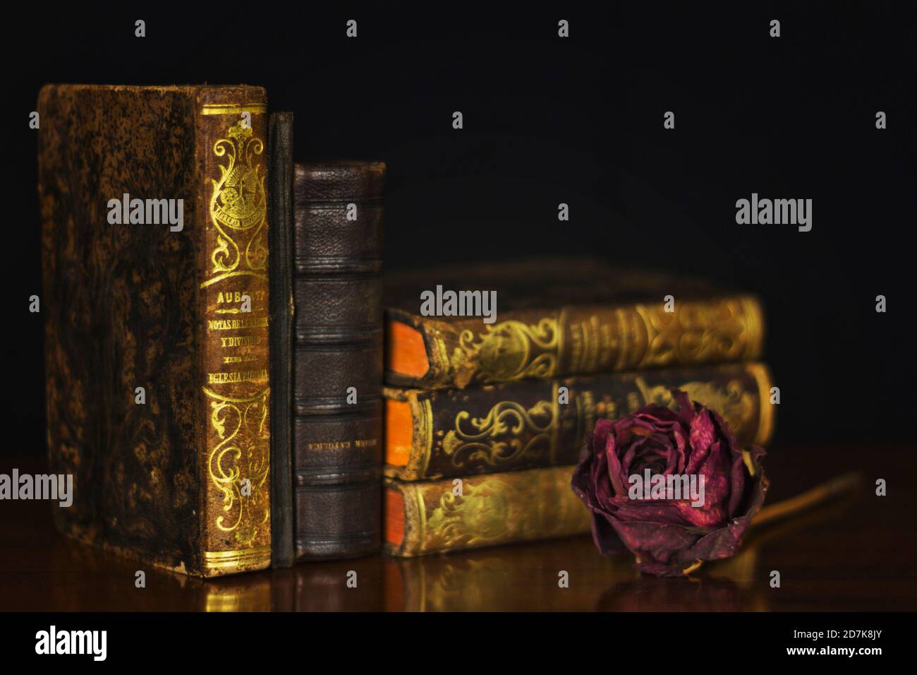 Still life of dried rose flowers with old books Stock Photo - Alamy