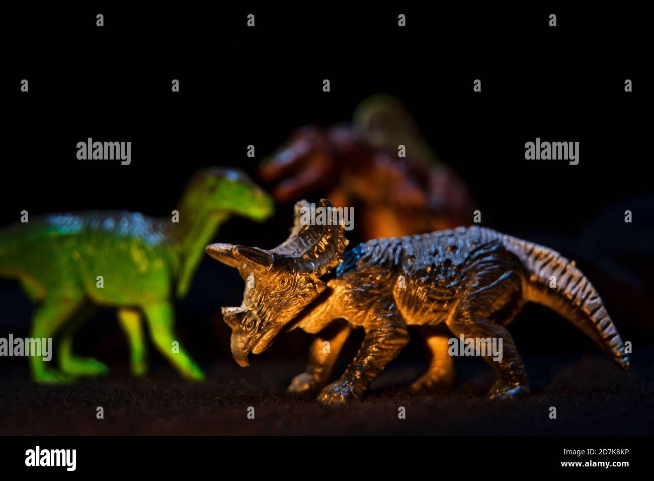 Detail of dinosaur figures on black background Stock Photo