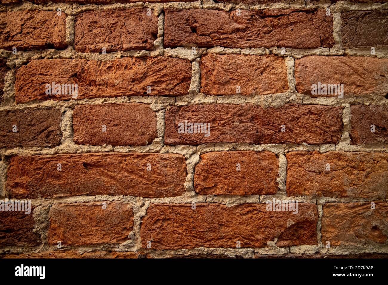 Weathered stained old brick wall background Stock Photo