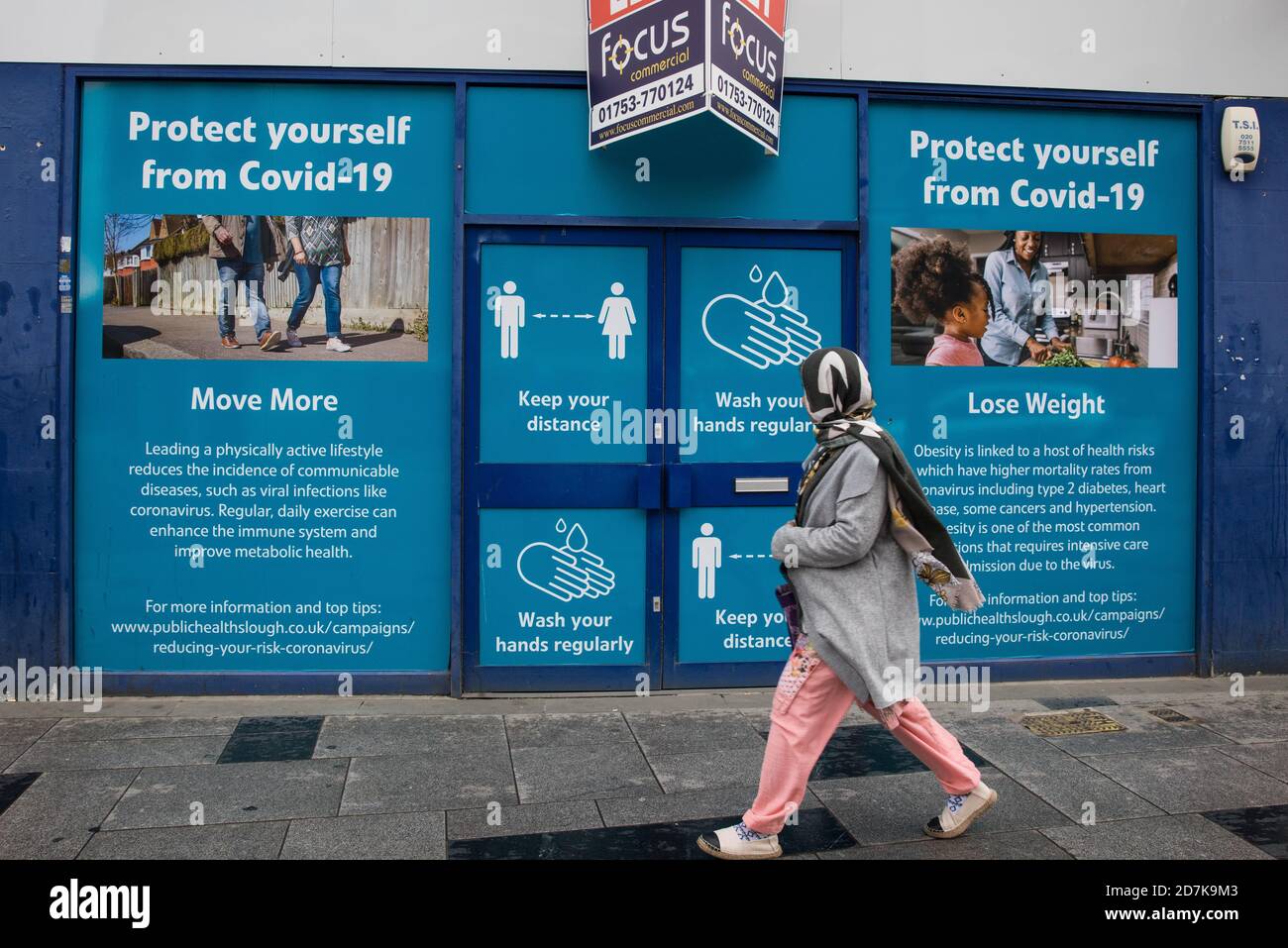 Slough, UK. 23rd October, 2020. A woman wears a face covering to help prevent the spread of the coronavirus. The Government has announced that Slough will change its COVID Alert Level status from Tier 1 Medium Alert to Tier 2 High Alert with effect from 00:01 on Saturday 24 October following a sustained rise in COVID-19 cases resulting in an infection rate of 153 cases per 100,000. Credit: Mark Kerrison/Alamy Live News Stock Photo