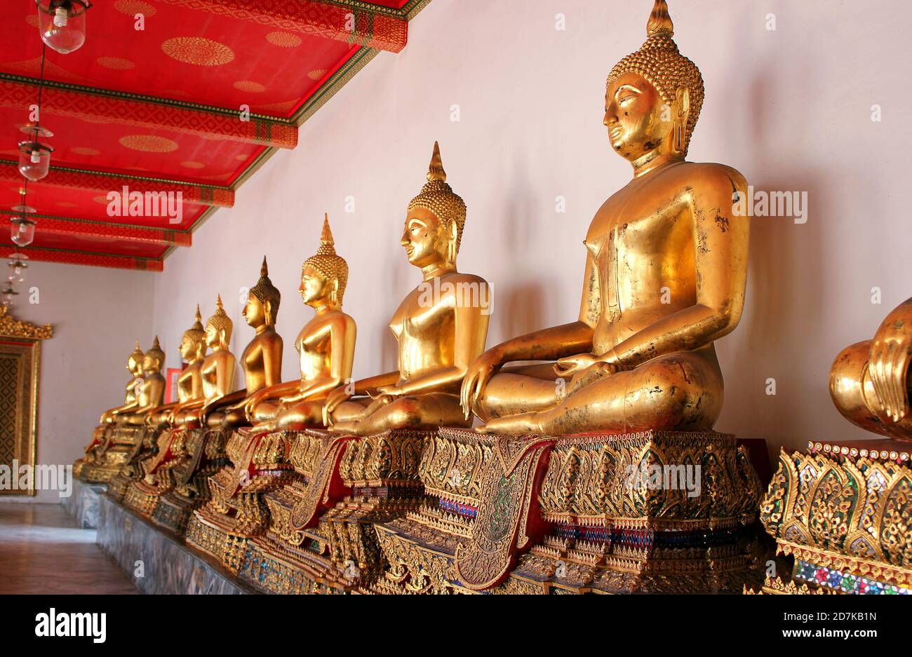 Golden Buddha is in a asian temple. Statues of golden Buddha in ...