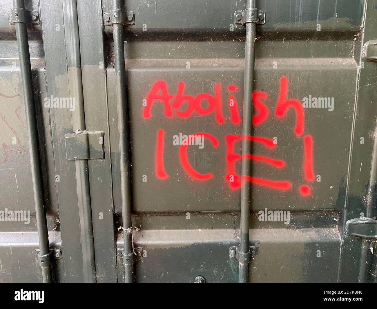 Abolish ICE, spray painted on a door in Prospect Park, Brooklyn, New York. Stock Photo
