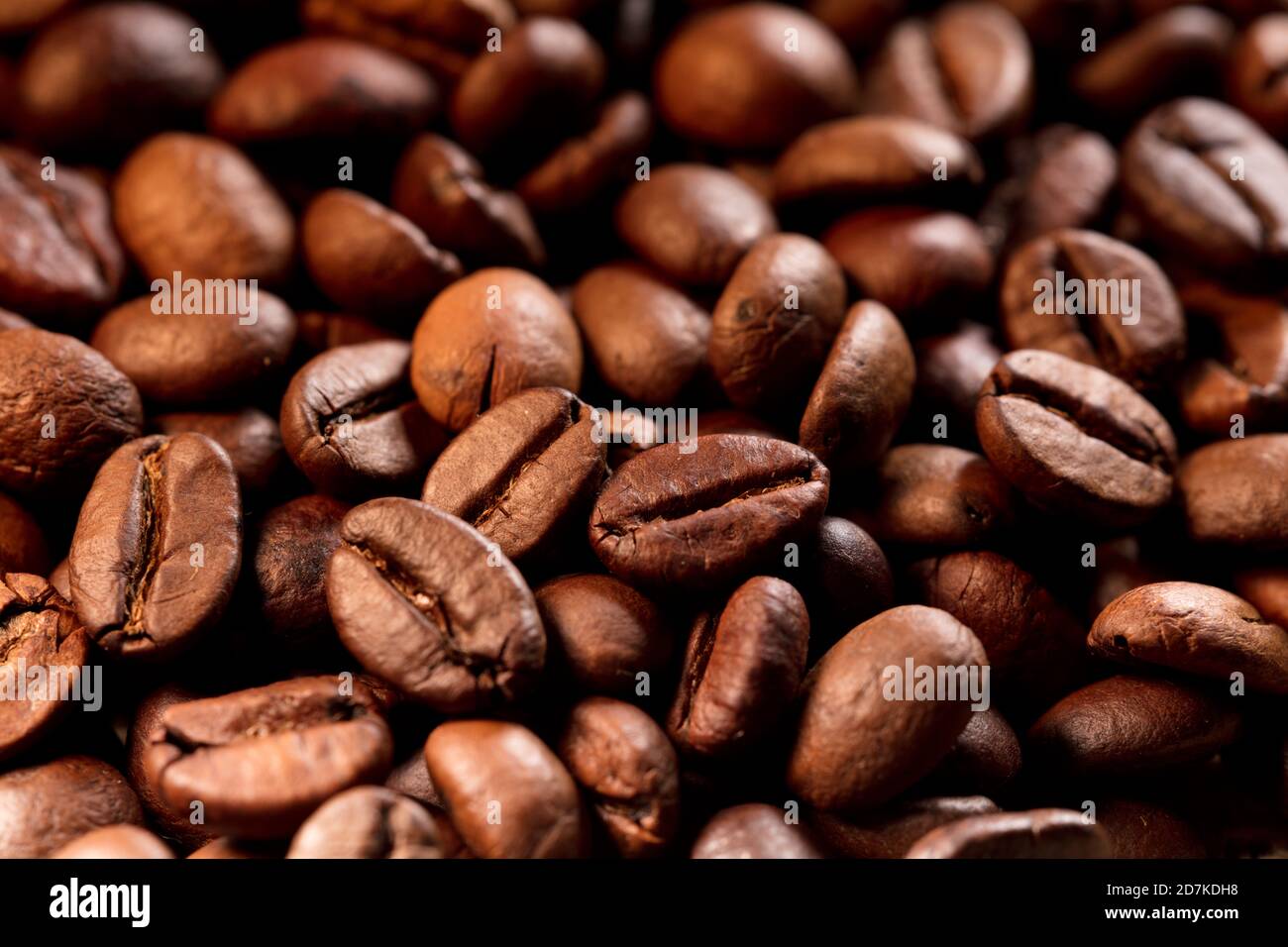 Roasted coffee beans background, Close up photo of coffee Stock Photo ...