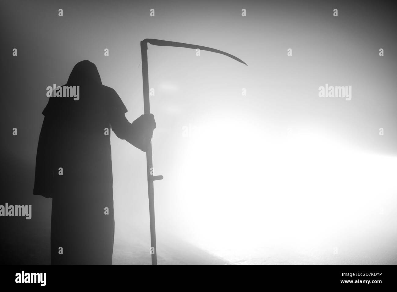 Death grim Reaper skeleton wearing a black robe and wielding a scythe ...