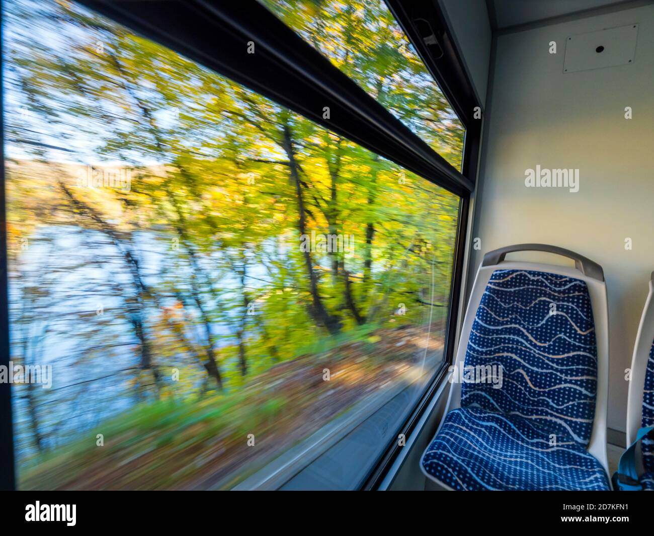 Train cabin interior inside blurry exterior passing by portraying speed in Plitvice lakes in Croatia Europe Stock Photo