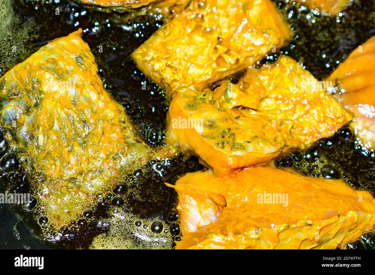 Deep frying fish cut in low flame looking delicious Stock Photo Alamy