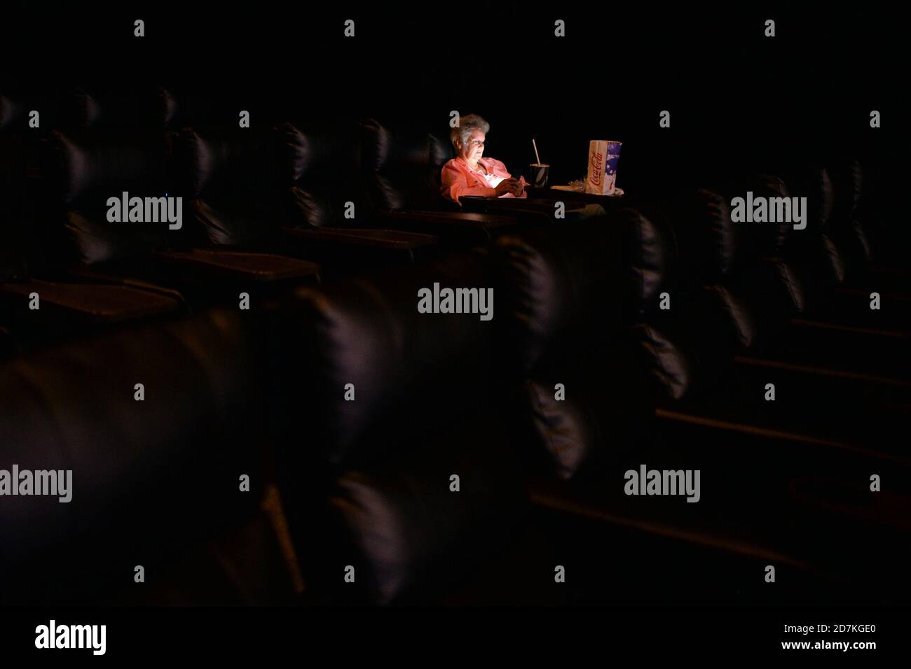 Yonkers, USA. 23rd Oct, 2020. Moviegoer Bernadette Reynolds, from Yonkers, looks at her cell