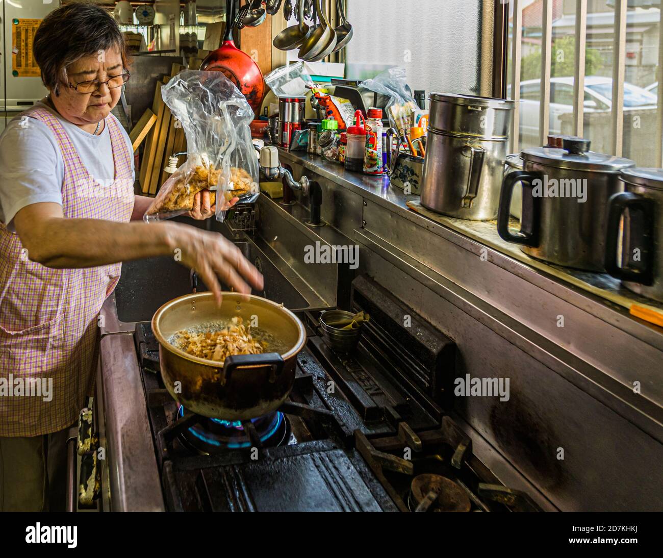 Making a Japanese miso soup in Nishiizu, Japan. Katsuobushi, known to us as bonito flakes, provide richness of flavor to the miso soup Stock Photo
