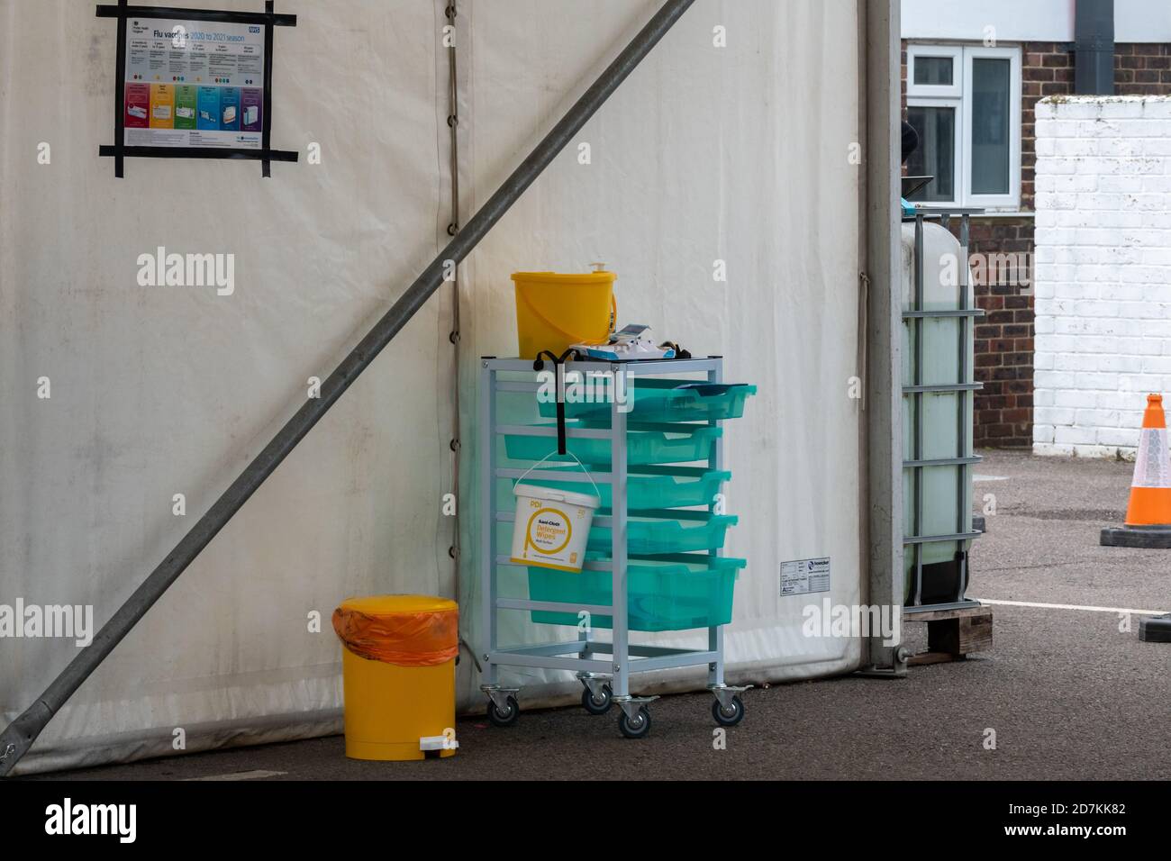 NHS drive through flu clinic providing influenza jabs vaccinations immunizations, Surrey, UK Stock Photo