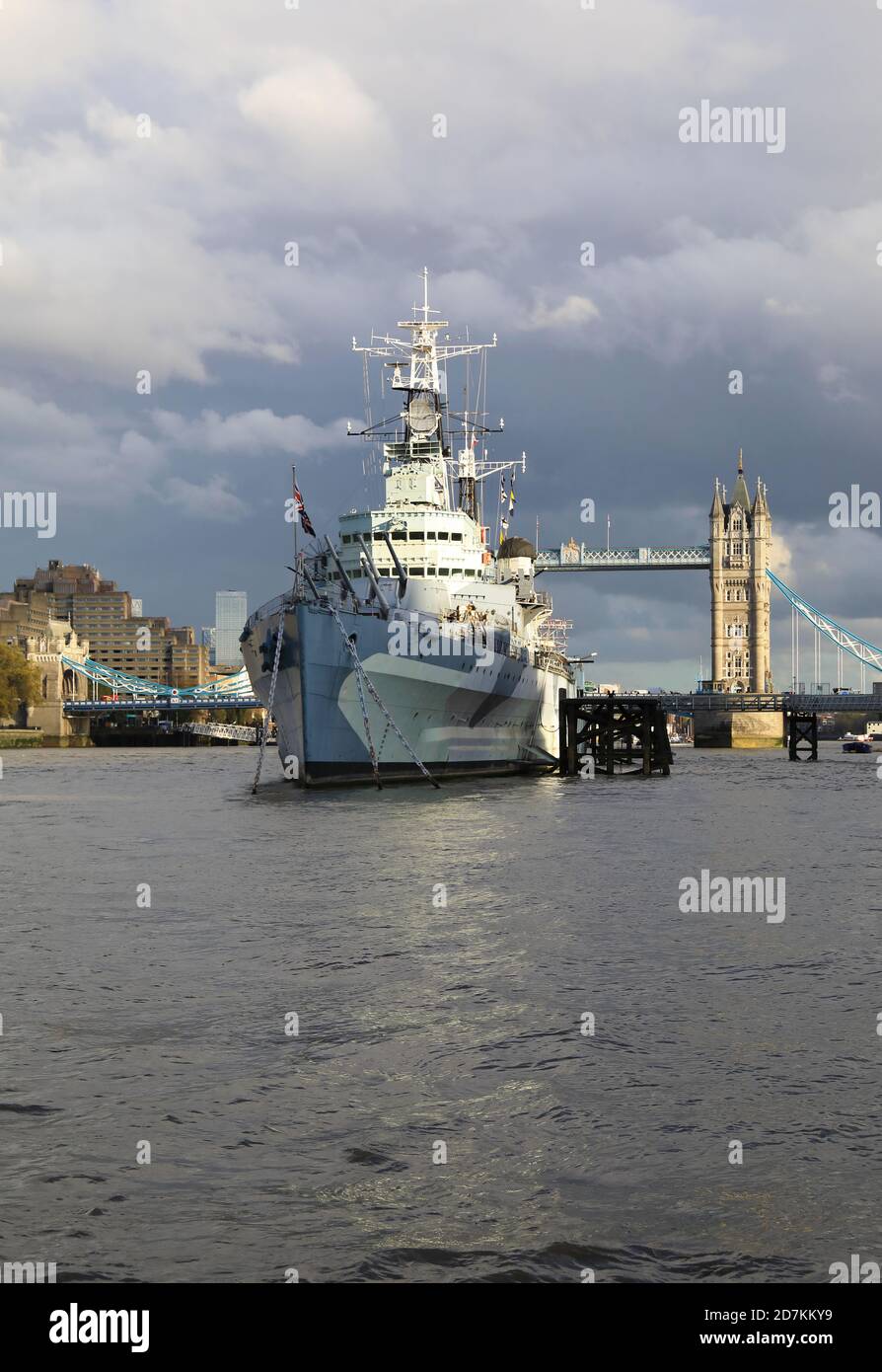 HM Belfast, WW2 warship turned museum on the River Thames in front of Tower Bridge, in London, UK Stock Photo