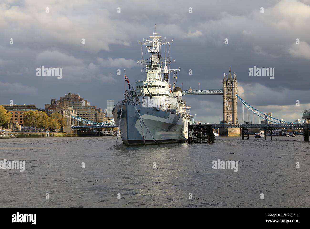 HM Belfast, WW2 warship turned museum on the River Thames in front of Tower Bridge, in London, UK Stock Photo