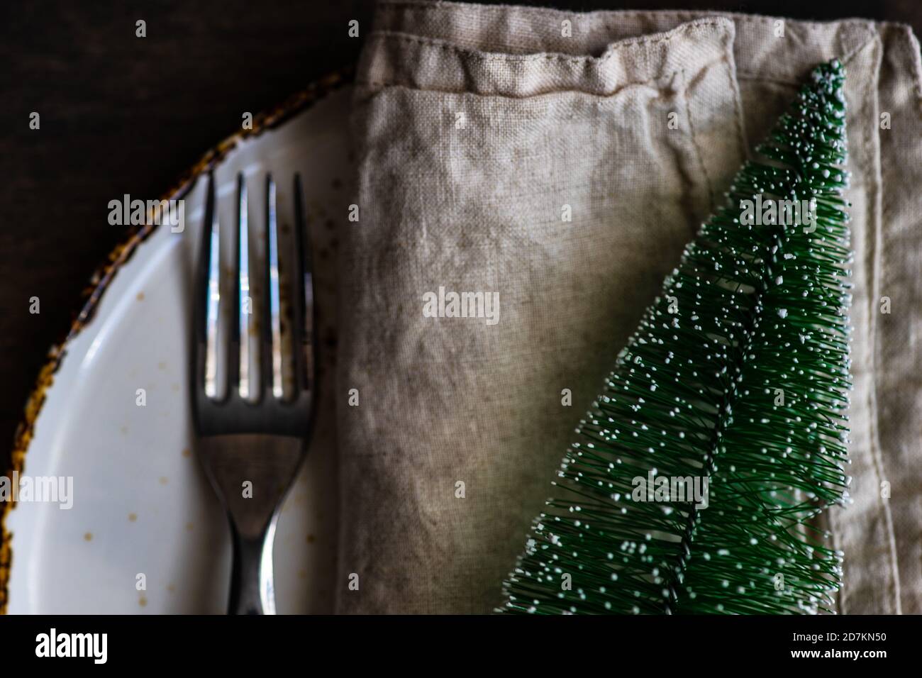 Minimalistic table setting for Christmas dinner on wooden table Stock Photo