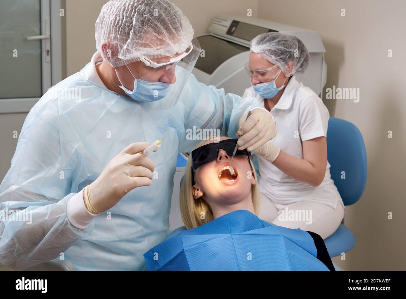 Dentist making local anesthesia shot before surgery Stock Photo Alamy