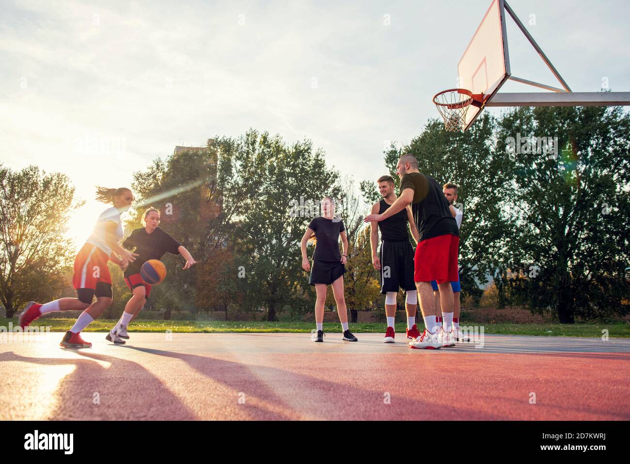 friends playing basketball