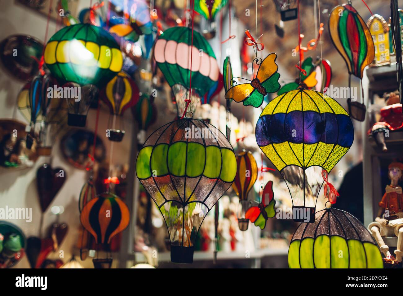 Showcase with murano glass figures in souvenir shop. Statues of air