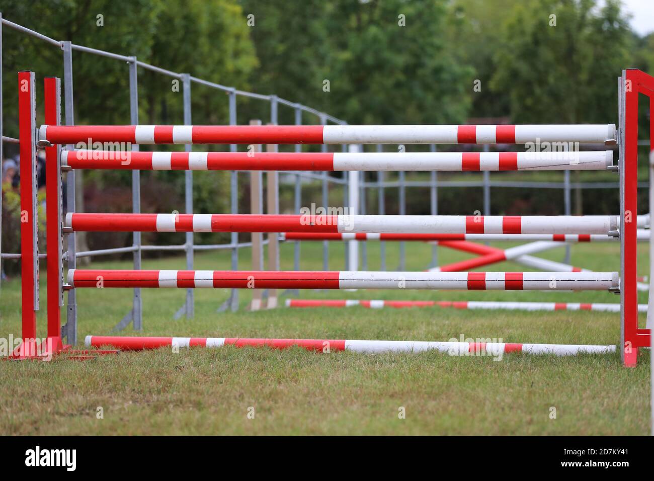 Colorful image of show jumping poles at an open air show jumping arena