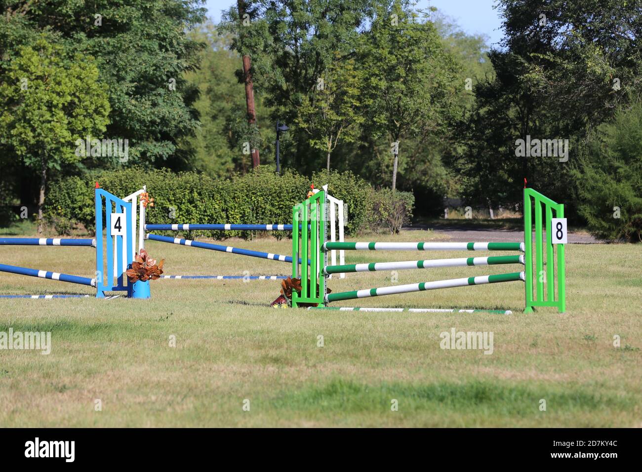 Colorful image of show jumping poles at an open air show jumping arena