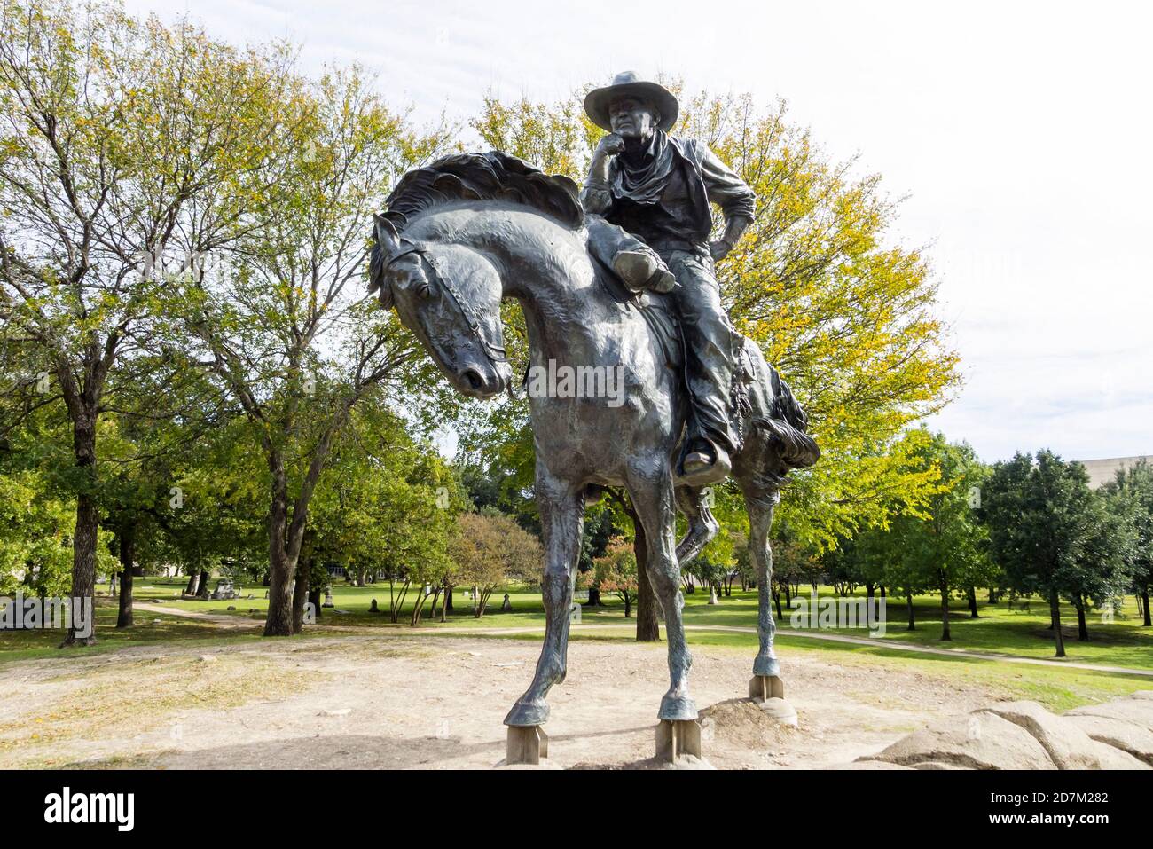Bronze Statue of Cowboy in Dallas Pioneer Plaza Stock Photo