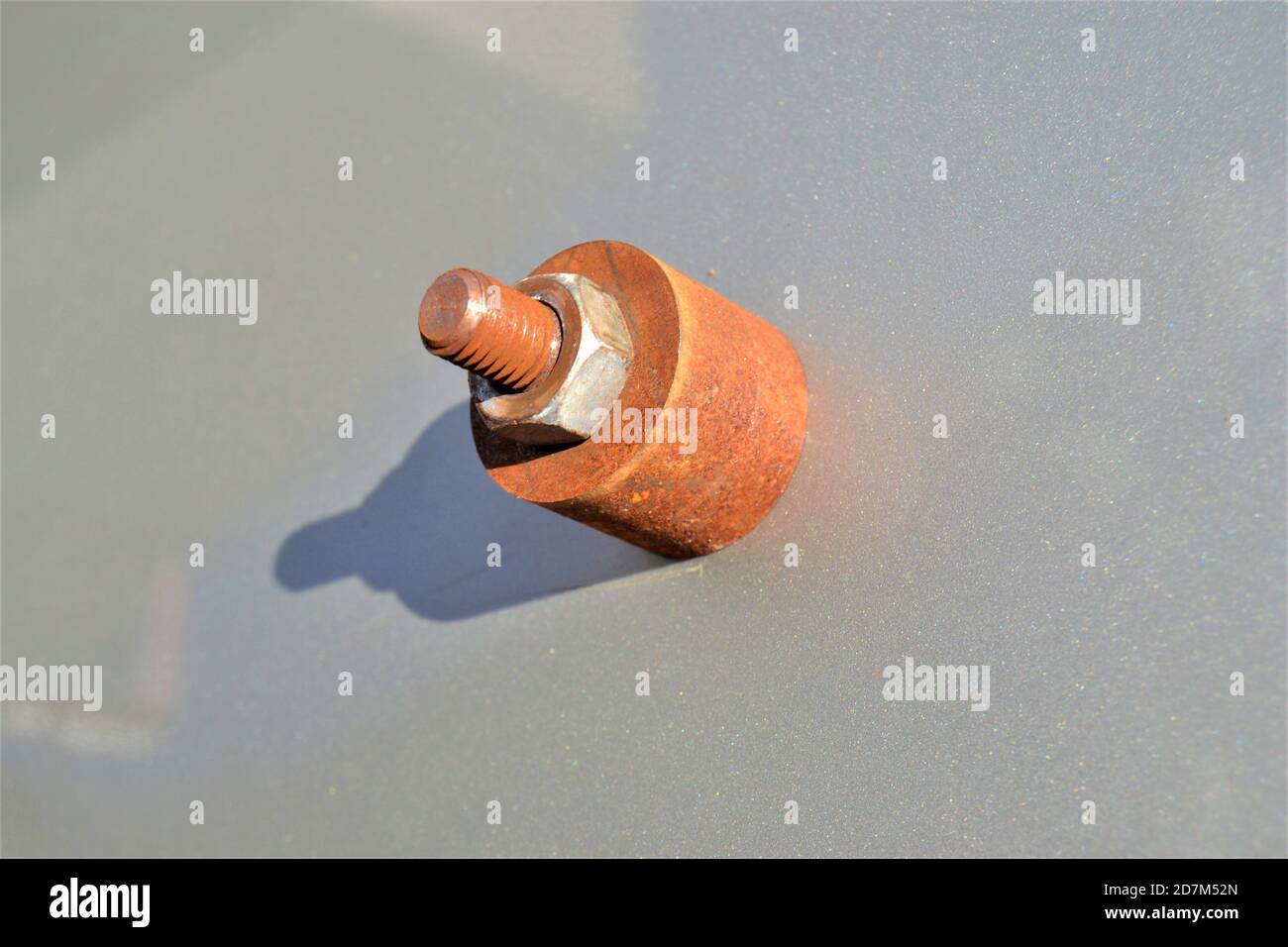 Rusted steel mile and hexagonal nut. Rusted metal exposed to corrosion