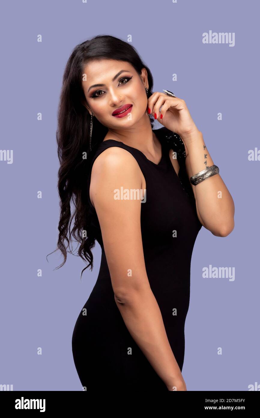 Beautiful Indian Fashion girl in black colour fashion posses Stock Photo
