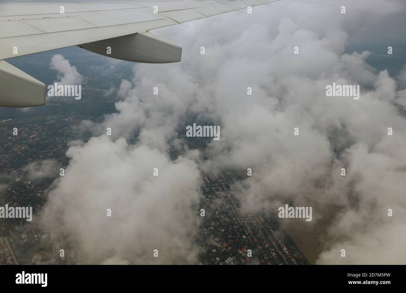Aircraft in wing above white clouds in the sky of airplane Stock Photo ...